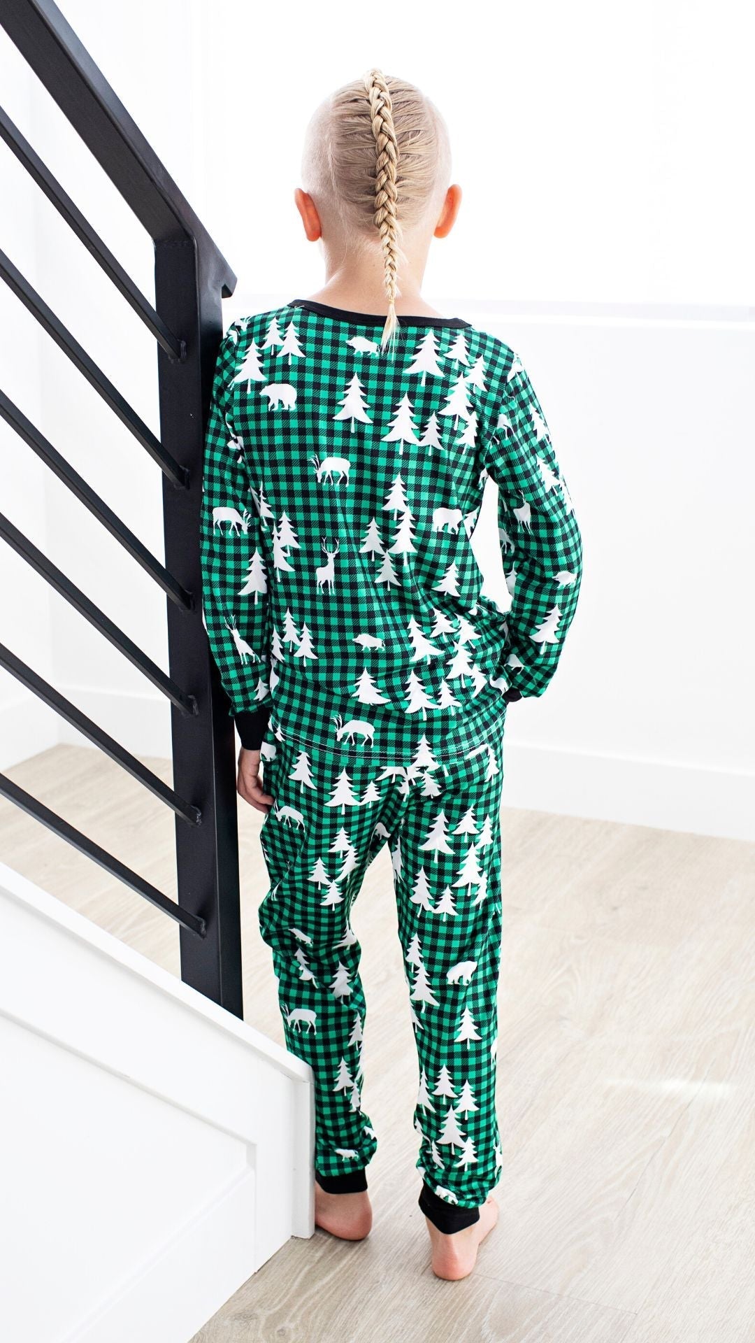 Matching Family Christmas Pajamas in Winter Forest